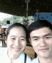 a man and a woman pose for a picture together