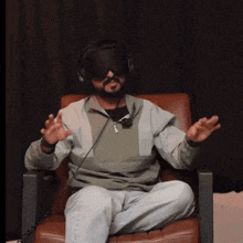 a man wearing headphones and a virtual reality headset