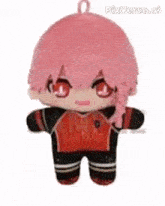a stuffed animal with pink hair and red eyes is wearing a red and black outfit .