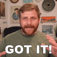 a man with a beard is making a got it sign
