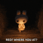 a stuffed animal is standing in a dark room with a candle in its hand .