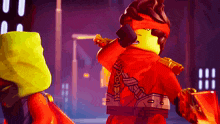 a lego character with a red scarf around his neck