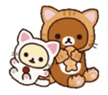 a couple of teddy bears sitting next to each other on a white background .