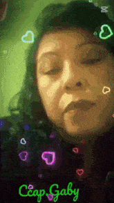 a woman with her eyes closed is surrounded by hearts and the name crap gaby on the bottom
