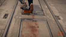 a blurred image of a person walking on a train track with the words long walk written on the bottom