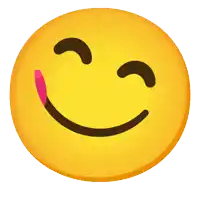 a yellow smiley face with a pink tongue sticking out of it
