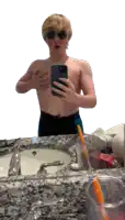 a man taking a selfie in front of a bathroom mirror
