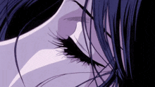 a close up of a woman 's eye with a purple background