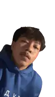 a young man wearing a blue hoodie with the letter k on the front