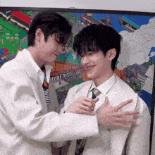 two men are hugging each other in front of a poster that says festival eastville