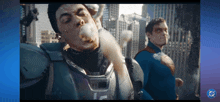 a man in a superhero costume with the letter lc on his chest