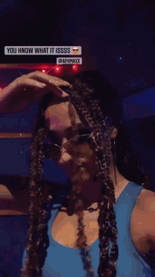 a woman wearing sunglasses and a blue top says you know what it issss @afkmaxx