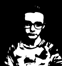 a black and white photo of a man wearing glasses
