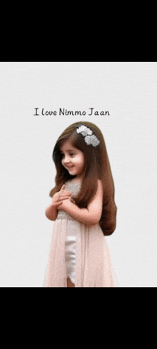 a little girl in a pink dress with the words " i love nimmo jaan " on the bottom