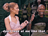 two women are sitting next to each other and one of them is saying " don 't look at me like that "