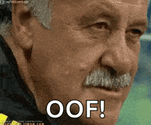 a man with a mustache is making a funny face and says oof