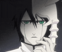 a black and white anime character with green eyes and a skeleton mask on his face