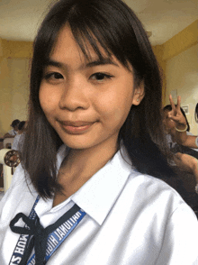 a girl with a lanyard around her neck that says ' jamulian '