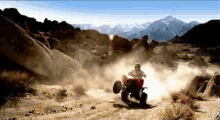 a person riding an atv on a dirt road