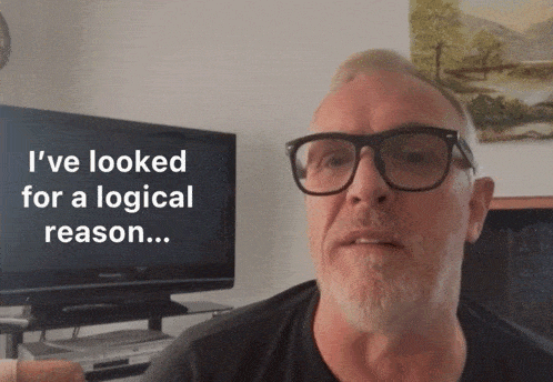 a man wearing glasses and a black shirt says i 've looked for a logical reason