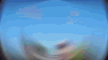a blurry picture of a person 's face against a blue background