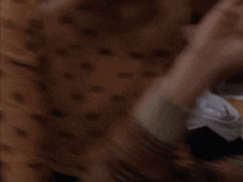 a blurry picture of a person 's face with a woman in the foreground