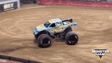 a monster jam truck is driving through the dirt