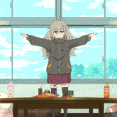 a girl is standing in front of a table with snacks and a bottle of milk on it