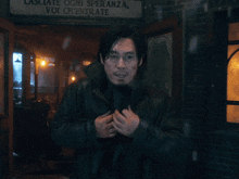 a close up of a man 's face with glasses