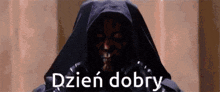 darth maul from star wars is wearing a hood and says dzien dobry in a foreign language .