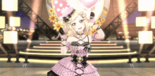 a girl in a pink dress holds a pink heart shaped balloon