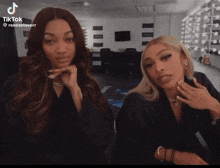 two women are standing next to each other in a room with a tiktok watermark