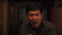 a man is holding a lighter in his hand and lighting it up