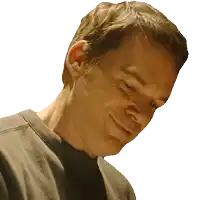 a close up of a man 's face with a gray shirt on
