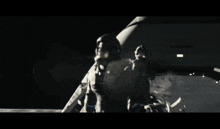 a man in a gas mask is standing in front of a plane