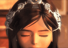 a woman with her eyes closed wearing a silver headband