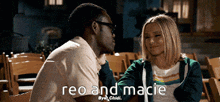 a man and a woman are sitting next to each other and the words reo and macie are on the bottom