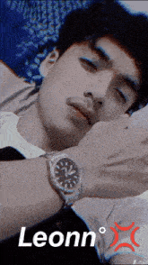 a man wearing a watch has the name leonn on the bottom