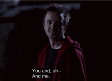 a man in a red hoodie says " you and uh and me "