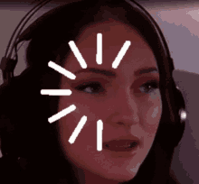 a woman wearing headphones has a white circle around her face .