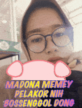 a woman wearing glasses and a head scarf has a sticker on her face that says madona memey pelakor nih