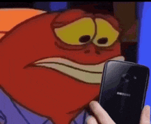 a person is holding a samsung cell phone in front of a cartoon character .
