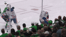 a hockey game is being played in front of a sn logo