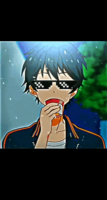 a boy wearing sunglasses is holding a cup of soda in his hand .