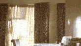 a room with a table and chairs and a window