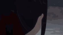 a close up of a person 's face with red eyes