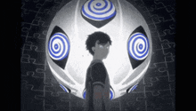 a man is standing in front of a puzzle ball