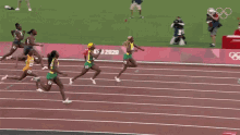 Running Elaine Thompson Herah GIF - Running Elaine Thompson Herah Team Jamaica GIFs