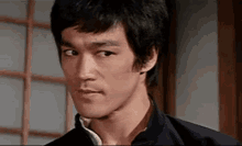 Bruce Lee Doesn'T Agree GIF - Skeptical Disappointed Dont Believe GIFs