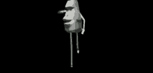 a statue of a man 's face with arms and legs is standing on a black background .